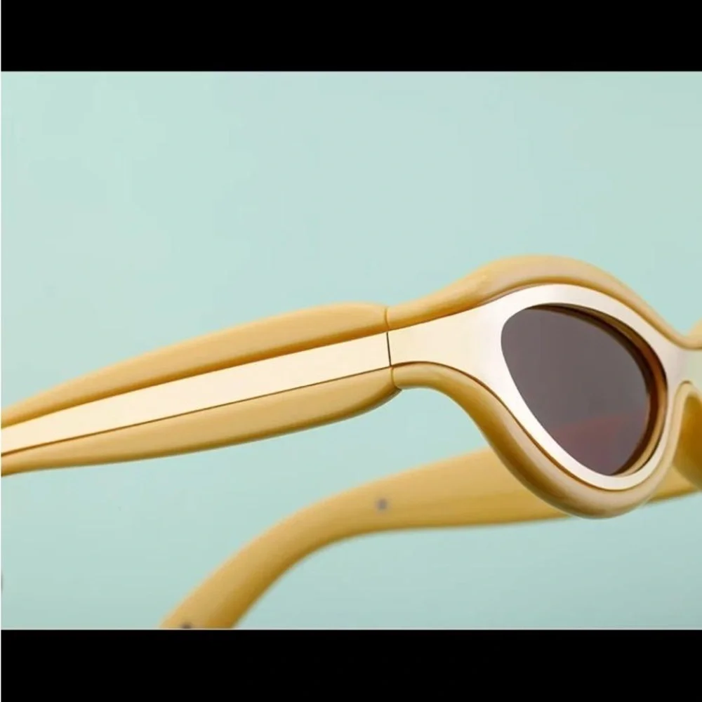 Luxury futuristic cat eye oval mustard pastel yellow steampunk sunglasses